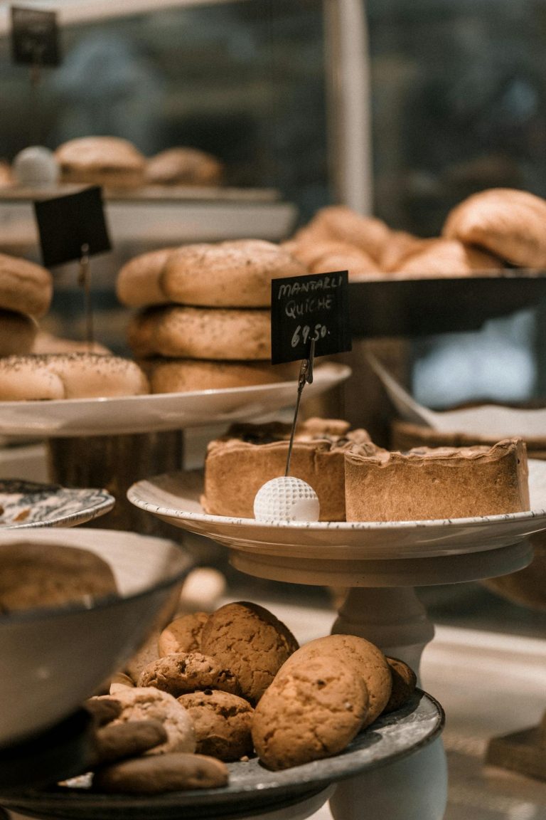 A showcase of freshly baked pastries and bread in a welcoming café setting.